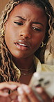 Frustrated, stress and black woman in home, cellphone for online announcement and bad news. Upset, smartphone and African person with reaction, confused and message to contact, unhappy and debt email