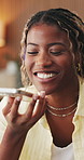 Woman, laugh and speaker phone in house for online communication, funny story or social media chat. Black person, recording and voice note in home with tech, contact and joke for gossip conversation.