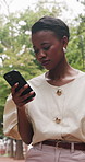 Outdoor, commute and businesswoman with phone for chat, stylist or communication with contact on web. Fashion advisor, smile and black person with mobile for project update, walk and travel to work