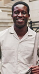 Business, face or black man in town with commute, ambition or morning travel in work routine. Happiness, portrait or male person in city with bag, employee journey or career pride at start of day.
