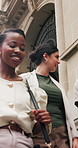 Happy, business people and walking with group in city for travel, work trip or outdoor commute. Team, employees or colleagues with smile on staircase for social, break or done with job in urban town