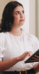Business, thinking and woman in office, tablet for guest list review and venue selection. Event planner, vision and person in workplace, tech for vendor management or digital app for schedule