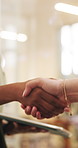 Tablet, business and handshake with women for deal, social media marketing or sponsorship offer. Tech, people and shaking hands in office for collaboration, advertising partnership and b2b agreement