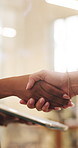 Tablet, business and shaking hands with women for offer, social media marketing or sponsorship deal. Tech, people and handshake in office for collaboration, advertising partnership and b2b agreement