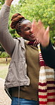 Woman, hiking and celebration with friends in nature, achievement or bonding with group on adventure. Outdoor, happy people and cheering for reunion on vacation, clapping and travel together on break
