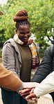 Friends, hiking and hand stack in nature, laughing and celebration for holiday adventure or hangout. Outdoor, happy people and cheering for reunion on vacation, bonding and travel together on getaway