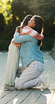 Outdoor, smile and mother with child for hug, support and family connection for weekend bonding. Happiness, woman and girl with embrace for security, trust and comfort for healthy relationship