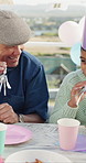 Happy, grandfather and blower with child at birthday party for celebration, gathering and bonding. Smile, old man and blowing horn for outdoor fun, grandchild laughing and support at special occasion