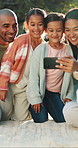 Selfie, family and girls in park, picnic for weekend break and bonding together with happiness. Outdoor, parents and mother with daughters, father and capture moment for profile picture and memory