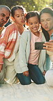 Parents, kids and selfie with funny face at park for picnic memory, status update and bonding. Sunshine, people and children with silly photo in nature for family outing, social media post or support