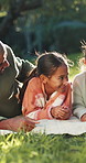 Dad, children and relax on picnic blank at park, smile and bonding on family vacation in summer. Man, girl and kids with care, connection and love for break on grass, nature or happy on holiday