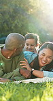 Parents, girl and laugh on picnic blanket at park, smile and bonding on family vacation in summer. Man, woman and child with care, connection and love with funny joke, memory or story in countryside
