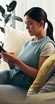 Phone, relax and woman on sofa in home with communication, networking or texting on mobile app. Happy, technology and female person with cellphone for notification, contact or social media in house.