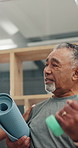 Elderly, man and weightlifting with dumbbell or physiotherapist for muscle rehabilitation in clinic. Senior, male person or discussion with therapist for recovery, health or wellness in hospital