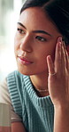 Headache, overthinking and woman in house with coffee, tiredness or pain with brain fog. Migraine, fatigue and female person in living room with warm beverage, strain or sore head with dizziness.