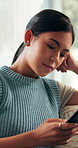 Cellphone, relax and woman on sofa in home with communication, networking or texting on mobile app. Reading, technology and female person with phone for notification, contact or social media in house