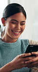 Phone, smile and woman on sofa in home with communication, networking or texting on mobile app. Happy, technology and female person with cellphone for notification, contact or social media in house.