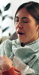 Woman, tired and sick with yawn in home with rest, relax and tissue for flu illness on sofa in living room. Person, exhausted and thinking with perspective, cold or burnout with fatigue at apartment