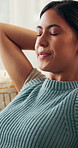 Relax, calm and woman on sofa in house for self care, peace or breathing in living room on weekend. Smile, mindfulness and female person on couch for wellness, health and comfortable break in home.