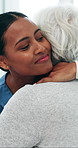 Hug, nurse and senior woman in lounge, smile and support for recovery, healing and gratitude. Home, medical service and old person with caregiver, wellness or embrace for empathy, help and healthcare