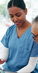Woman, nurse and tablet with senior patient for medical diagnosis, results or health advice in home. Female person, caregiver or discussion with elderly man on technology for schedule in retirement