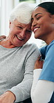 Happy, support and caregiver with old woman hug in nursing home for support, care and connection. Retirement, healthcare and nurse with elderly person with disability for embrace, empathy and trust