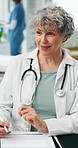 Mature, woman and doctor with documents for consultation, health diagnosis or checkup in clinic. Female person, healthcare worker or discussion for medical advice, assistance or service in hospital