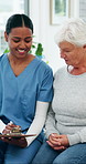Nurse, old woman and happy with clipboard for consultation, writing and questions for symptoms. Elderly person, healthcare professional and smile with wellness checklist, report and talk at clinic