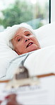 Conversation, sick and old woman in clinic clipboard for symptoms and healthcare info. Pensioner, medical service and senior patient in hospital, documents and checklist for insurance and retirement