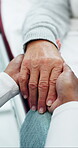 Doctor, holding hands and comfort with old person in office for terminal diagnosis, support and healthcare. Medical, help and empathy with senior patient in clinic for advice, trust and cancer news