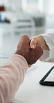 Senior, doctor and agreement with handshake for consultation, thank you or deal in hospital. Elderly, person or healthcare worker shaking hands with partnership for b2c, medical service or approval