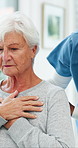 Old woman, chest pain and assessment with nurse at clinic for symptoms, check and cough with consultation. People, healthcare professional and exam for wellness, breathing and retirement at hospital