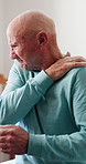Senior, man and shoulder pain with injury in home for discomfort, fibromyalgia or accident. Elderly, male person or pensioner with sore arm or ache for joint inflammation, stiffness or muscle tension