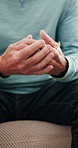Stress, hands and senior man on sofa in home with nervous, anxiety or mental health in living room. Retirement, comfort and elderly male person with depression, worry or regret in house with emotion.