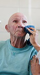 Hands, caregiver and old man with hygiene in home for washing, personal care and helping hand. Retirement, senior person and nurse with face cloth in assisted living for grooming, homecare or support