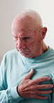 Senior, man and cough with chest pain for heart attack or cardiac arrest in retirement home. Sick, elderly or male person with illness, bronchitis or respiratory infection for asthma or acid reflux