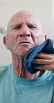 Hands, caregiver and old man with hygiene in bathroom for washing, personal care or assistance. Retirement, senior person or nurse with face cloth in assisted living for grooming, homecare or support