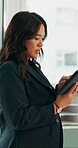 Reading, serious or woman with tablet in office, investment or venture evaluation for profitability. Market research, review proposal or wealth manager with online risk assessment, scroll or tech