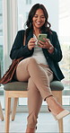 Woman, phone and texting in row for job interview at office in lobby, window or smile at recruitment agency. Person, employee and happy with smartphone in waiting room, queue or mobile app at company