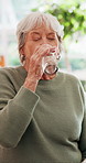 Senior, woman and drinking with water for medication, vitamins or antibiotic in home. Elderly, female person or mineral liquid with prescription or beverage for medical cure, recovery or hydration