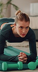 Fitness, plank and woman on floor in home for exercise routine, wellness and core strength. House, weights and person on yoga mat for workout, training or active hobby for muscles, balance and health