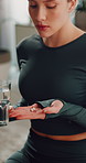 Water, medication and woman in home with health, supplements or pills for exercise recovery. Tablets, wellness and female person with drink and vitamin capsules for weightloss or detox in apartment.