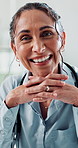 Doctor, woman and face with smile in office for medical support, health check up or treatment. Medicine, mature professional and portrait in clinic for cardiology, wellness or healthcare for about us