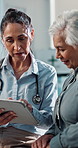 Doctor, discussion and old woman in hospital with tablet, medical advice or test results for recovery. Healthcare worker, elderly person and talk in clinic with tech, diagnosis or update for healing.