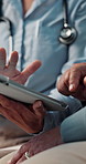 Doctor, hands and senior woman with tablet for consultation, test results or medical advice in hospital. Healthcare worker, elderly person and appointment in clinic with tech, feedback or assistance.