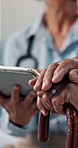 Hands, tablet and doctor consulting an old person with walking stick for checkup, diagnosis or health. Tech, expert and senior patient with disability in clinic for arthritis update, results and help