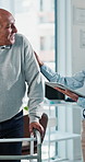 Tablet, physiotherapist and old man with walker in clinic, mobility recovery and progress discussion. Rehabilitation, specialist or happy senior patient with chat for healing advice, tech or support
