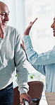 High five, physiotherapist or old man with walker in clinic, mobility assistance or progress celebration. Rehab, happy specialist or senior patient with support for recovery, laugh or walking goal