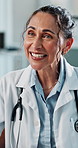 Doctor, medical and happy woman talking to couple for history, feedback or good news in clinic. Mature person, healthcare worker and patient consultation, checkup or advice with results in hospital