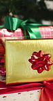Boxes, gift and ribbon at house for Christmas surprise, celebration and holiday tradition. Tree, package and present with bow for appreciation, secret santa and xmas decoration for festive season 